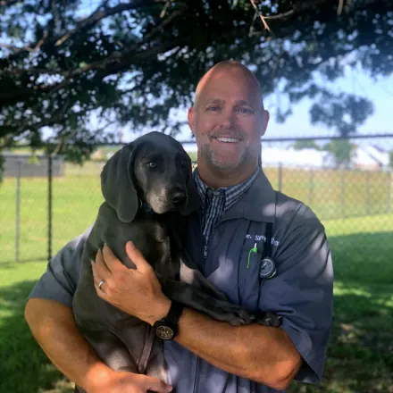 Dr. Steve Albers with a dog